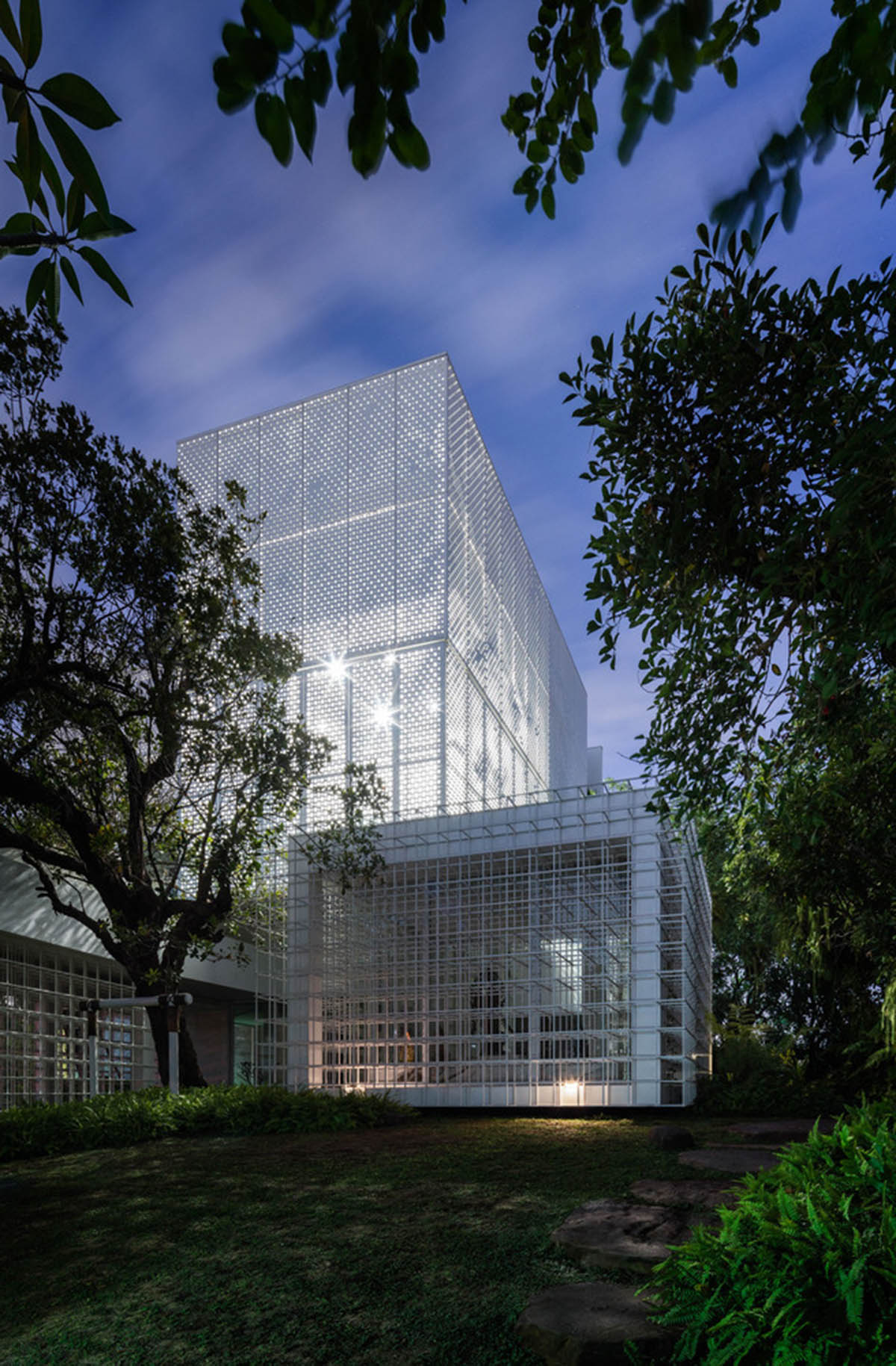 AAd built self-sustainable residence with perforated facade and steel rods in Thailand