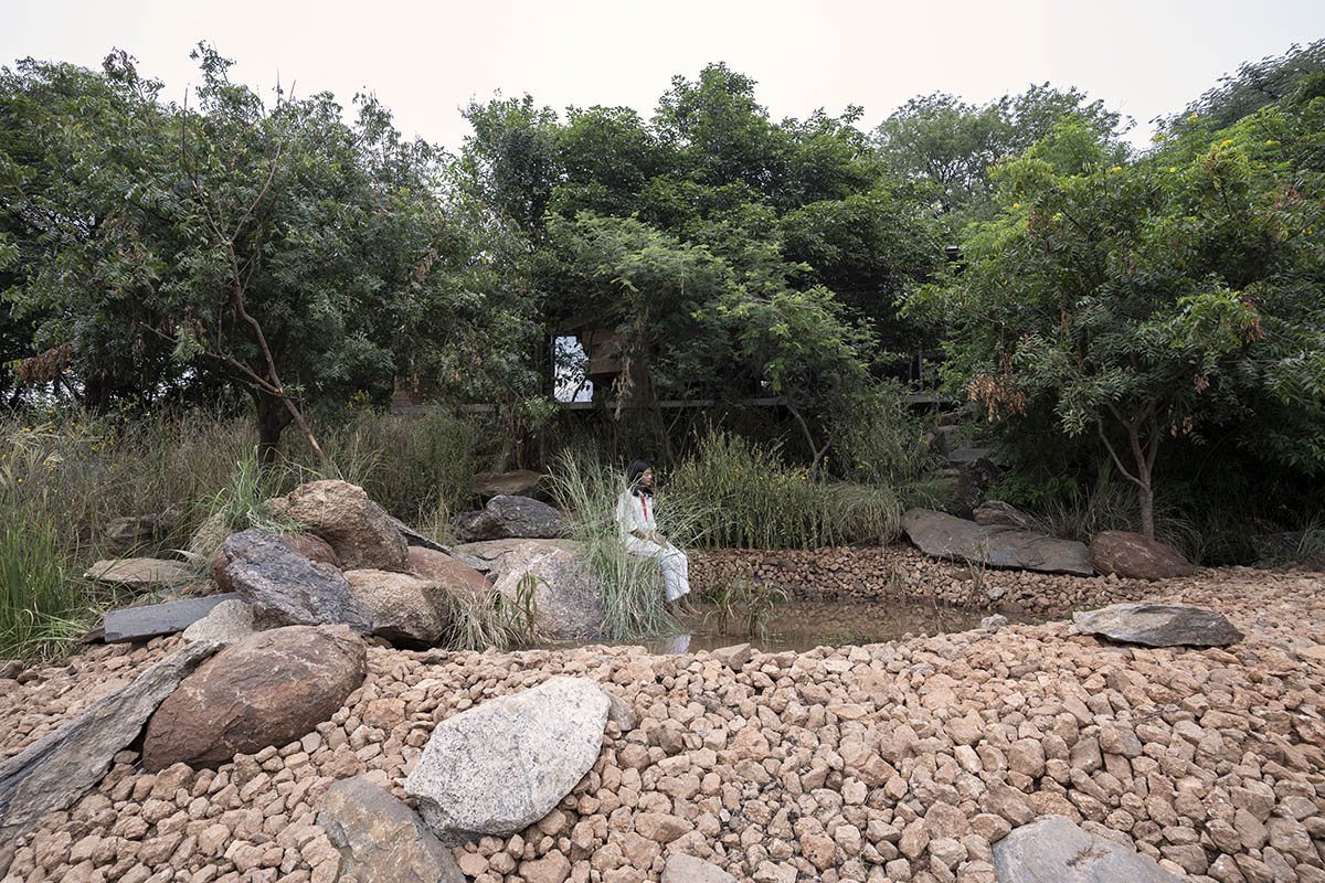 Wallmakers reveals snake house that forms a whirlpool on a steep hillside in India