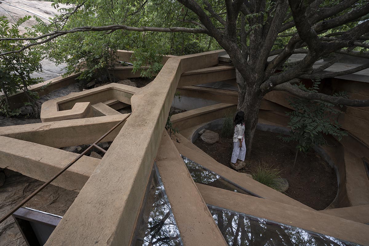 Wallmakers reveals snake house that forms a whirlpool on a steep hillside in India