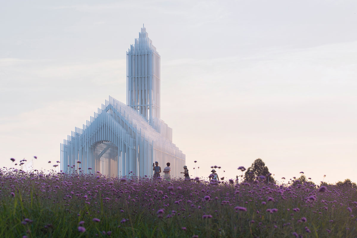 A church made of thousands of white thin beams looks like suspended in the air in lavender field