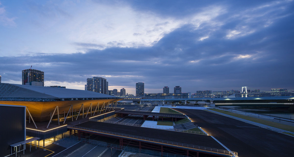 Nikken Sekkei and Shimizu Corporation-designed gymnastics centre features a floating wooden vessel