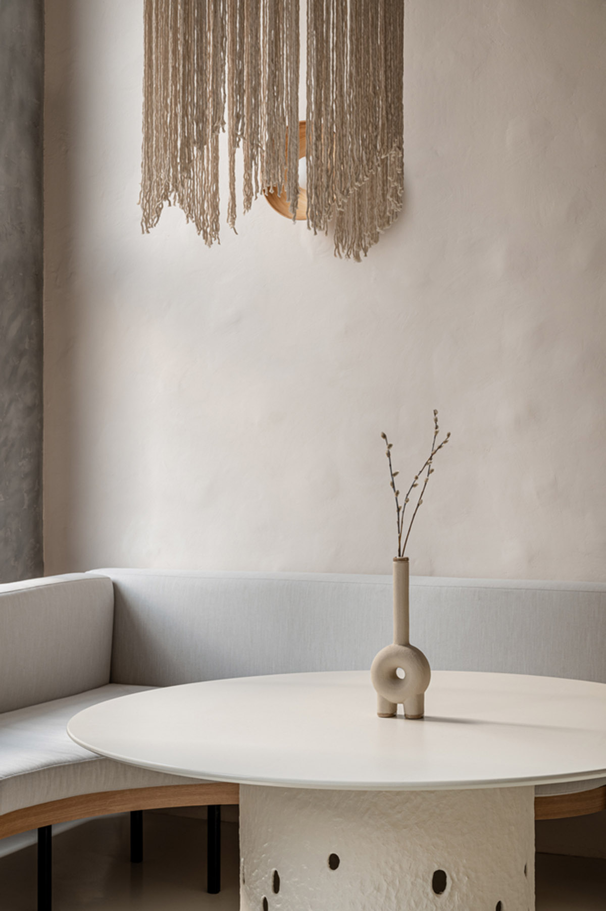 Earth-toned materials and soft lines form interiors of this ready-to-eat food restaurant in Kyiv