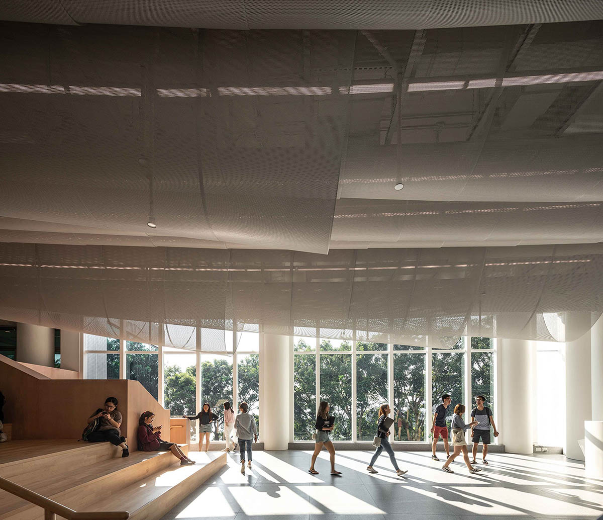 Atelier Nuno Architects suspends tubular aluminum panels from the ceiling of a lobby in Hong Kong
