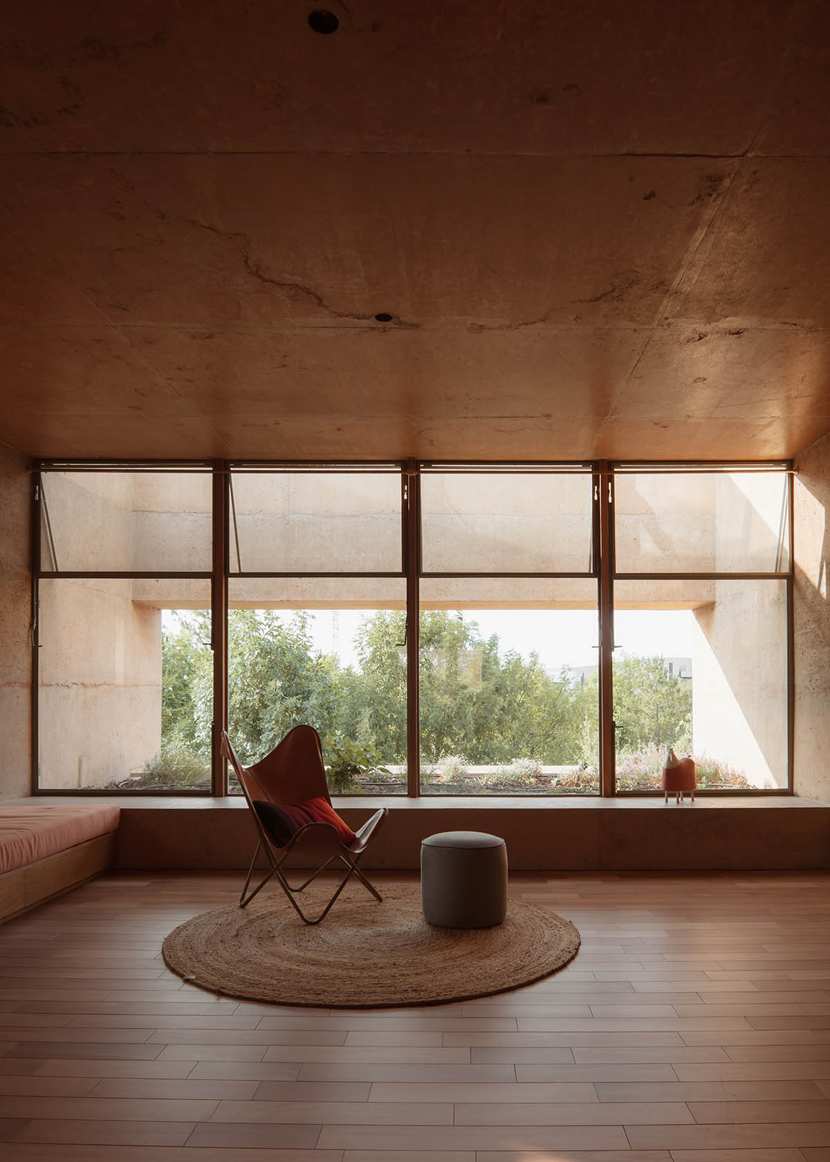 Casa Tejocote features intertwined volumes with pigmented concrete and tepetate colors in Mexico