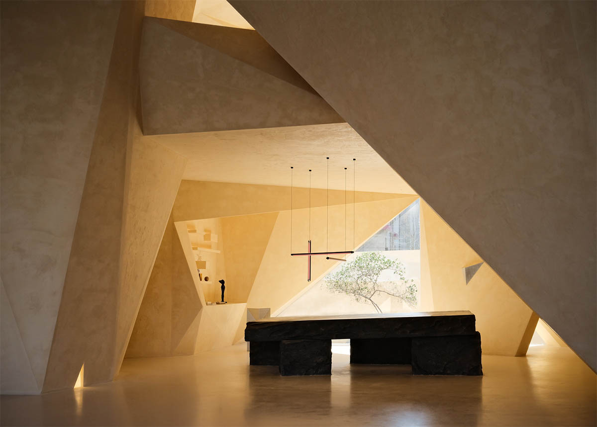 Eyewear showroom features folded surfaces blending with soft light in Zhejiang, China