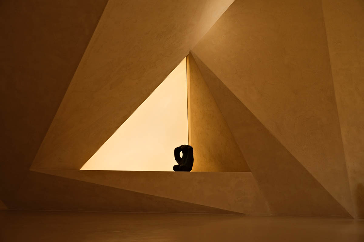 Eyewear showroom features folded surfaces blending with soft light in Zhejiang, China