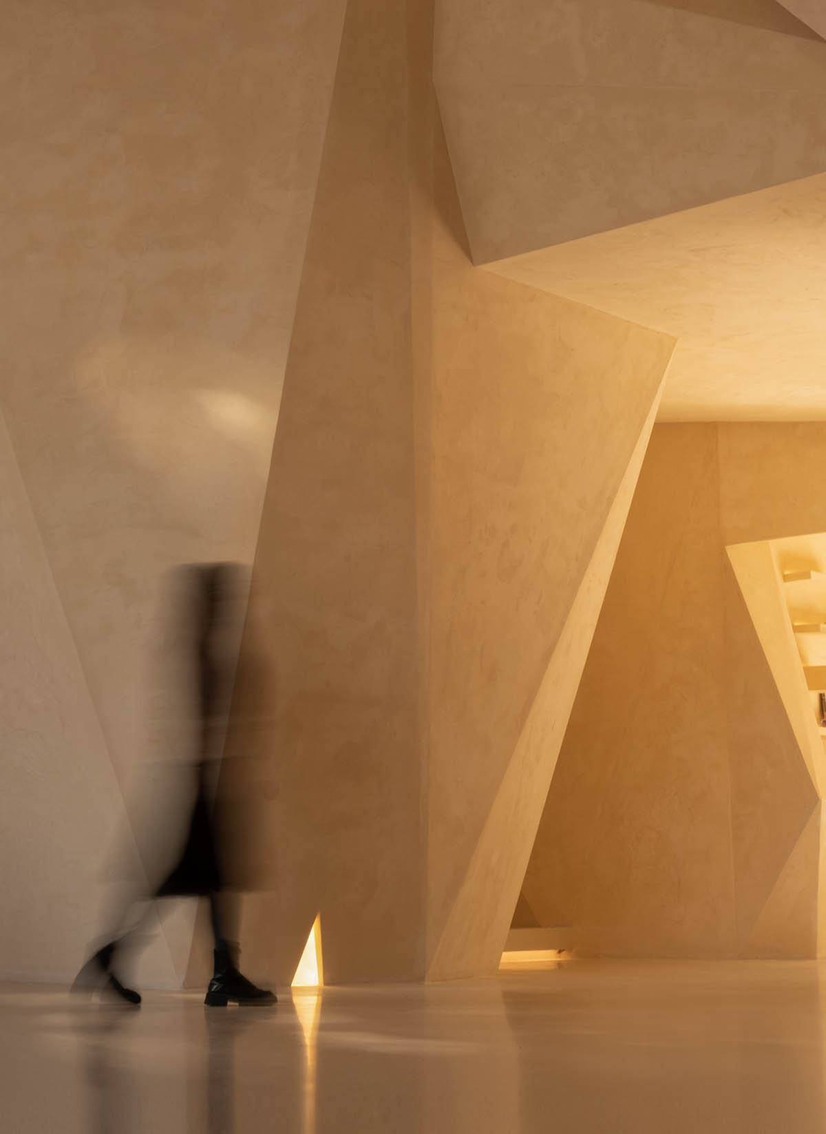 Eyewear showroom features folded surfaces blending with soft light in Zhejiang, China