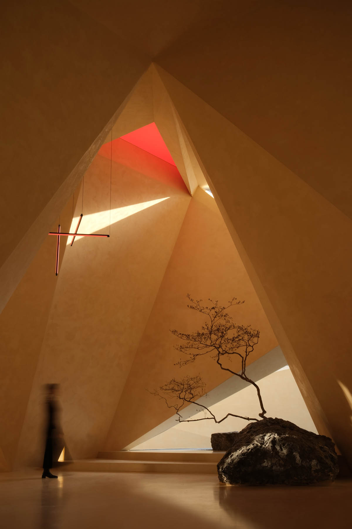 Eyewear showroom features folded surfaces blending with soft light in Zhejiang, China