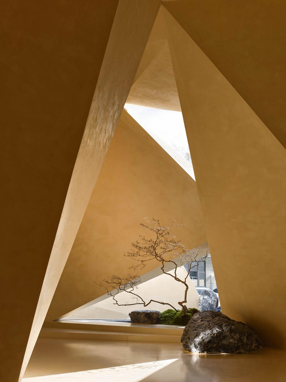 Eyewear showroom features folded surfaces blending with soft light in Zhejiang, China