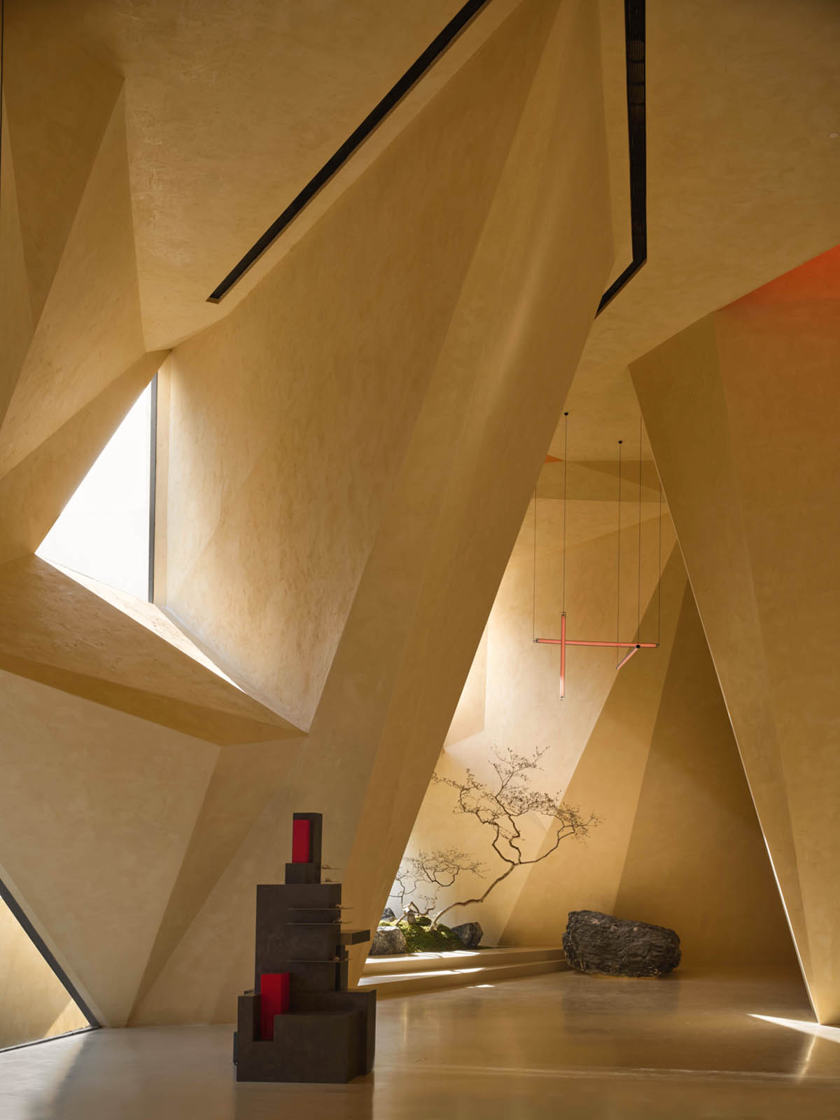 Eyewear showroom features folded surfaces blending with soft light in Zhejiang, China