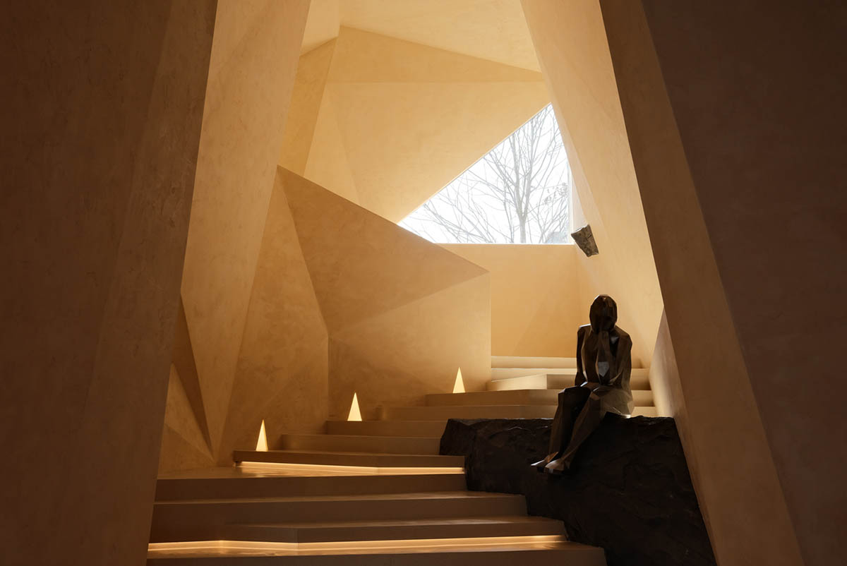 Eyewear showroom features folded surfaces blending with soft light in Zhejiang, China