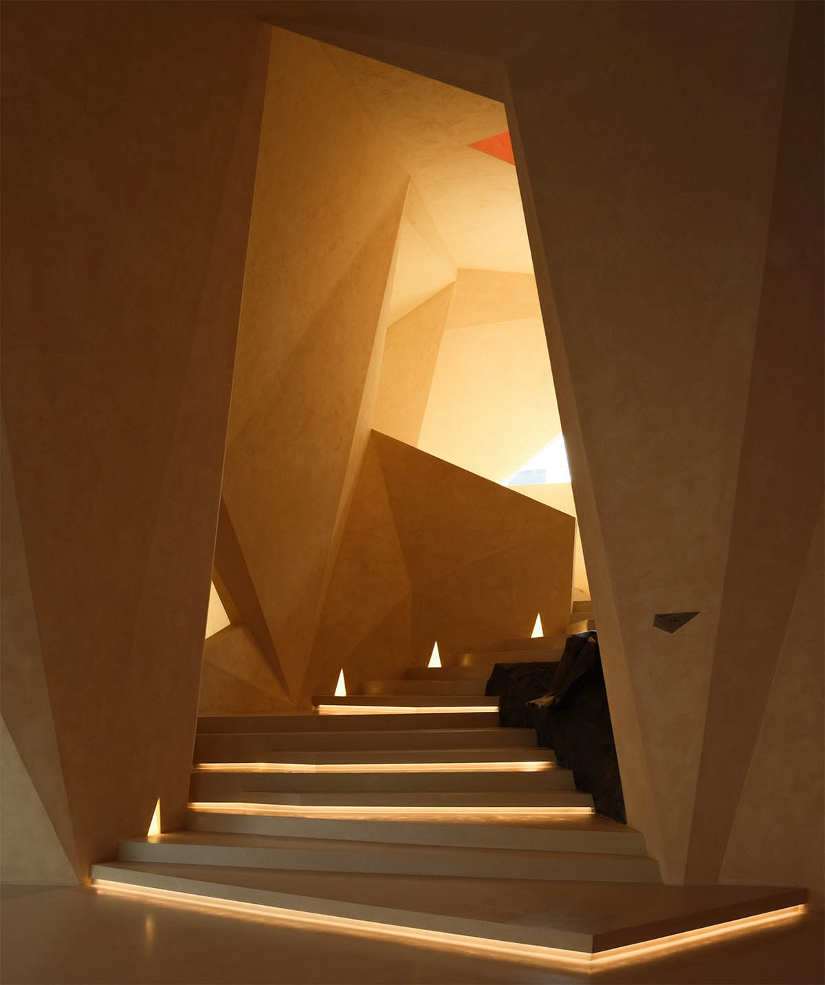 Eyewear showroom features folded surfaces blending with soft light in Zhejiang, China