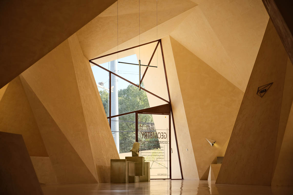 Eyewear showroom features folded surfaces blending with soft light in Zhejiang, China