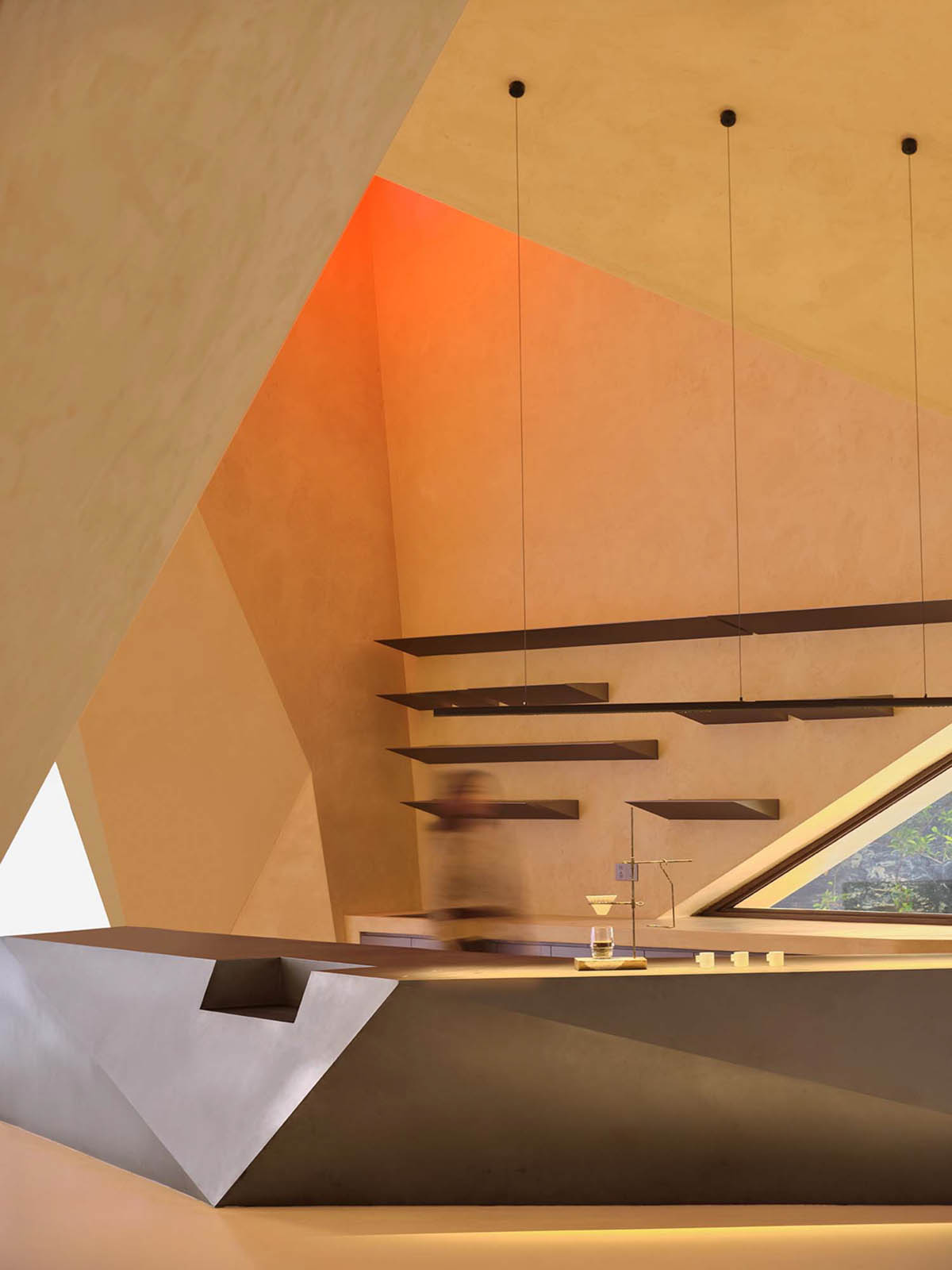 Eyewear showroom features folded surfaces blending with soft light in Zhejiang, China