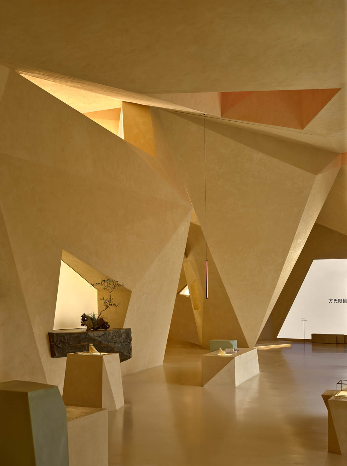 Eyewear showroom features folded surfaces blending with soft light in Zhejiang, China