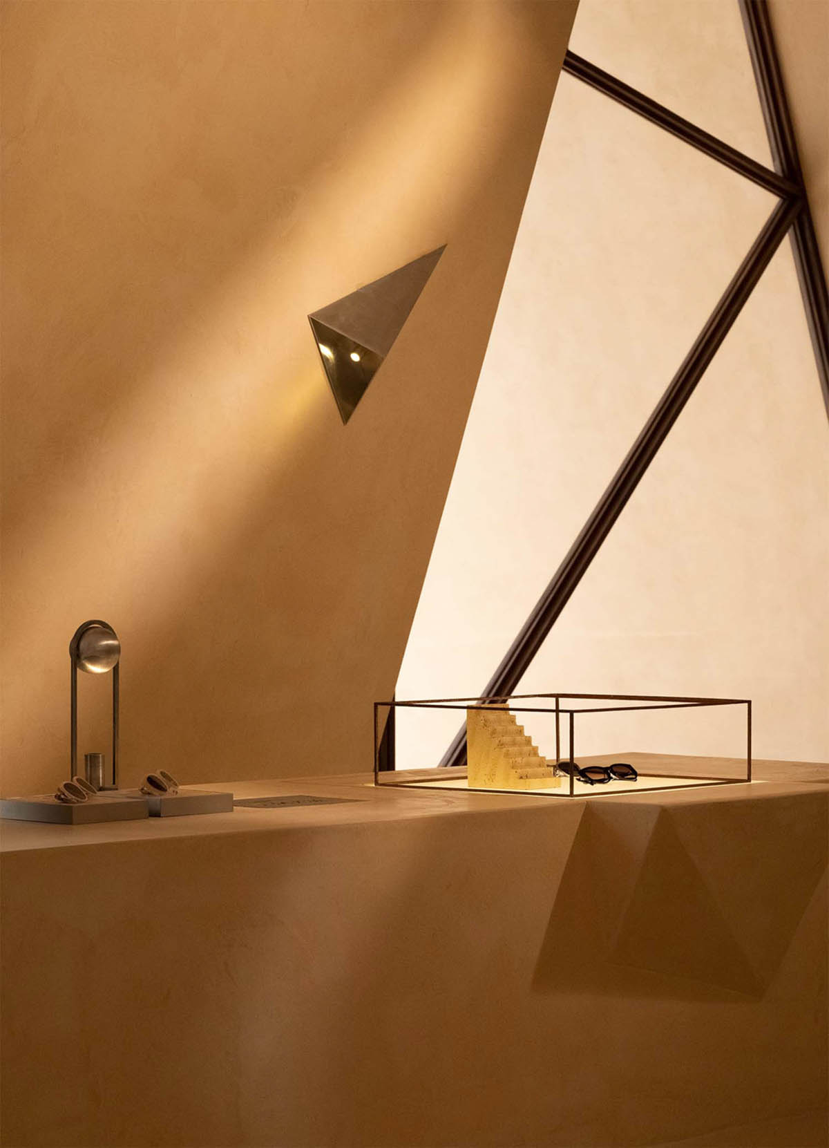 Eyewear showroom features folded surfaces blending with soft light in Zhejiang, China