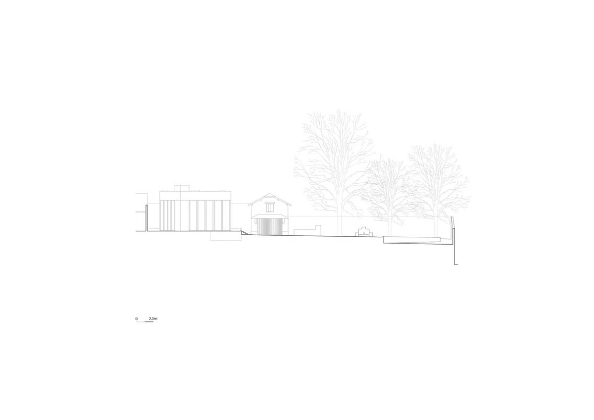 House 2 is a pigmented concrete addition with light-filled winter garden to existing house in Porto