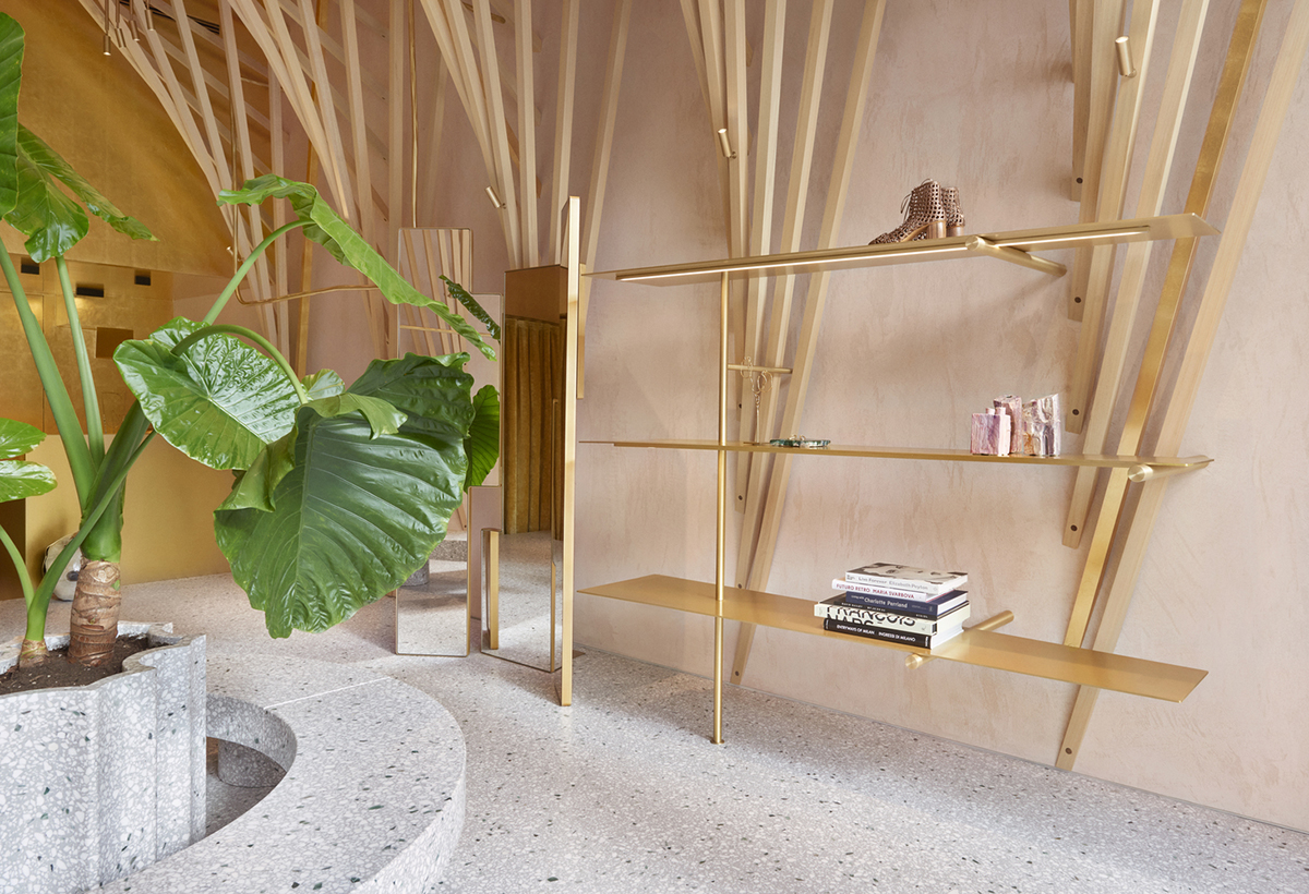 Golden and powder-colored details dominate forte_forte forte dei Marmi boutique in Italy
