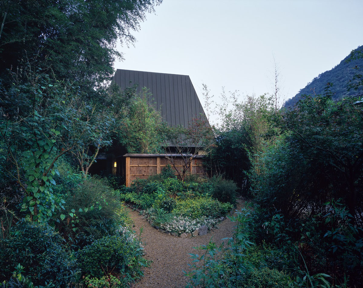 genarchitects designs Yitingting Cottage within bamboo forest hillside as a secluded space 