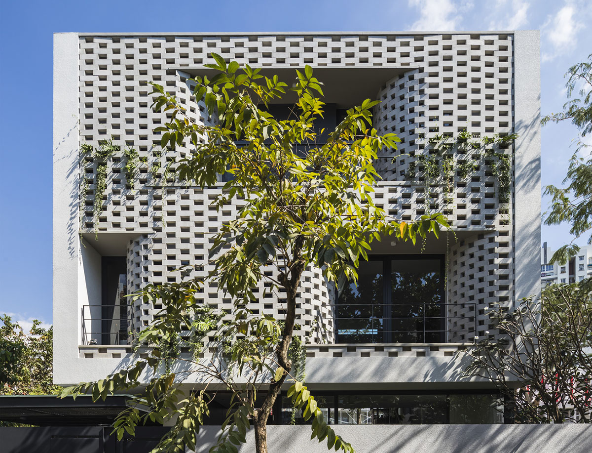 Nha Dan Architects built this house with porous facade to provide maximum thermal comfort in Vietnam
