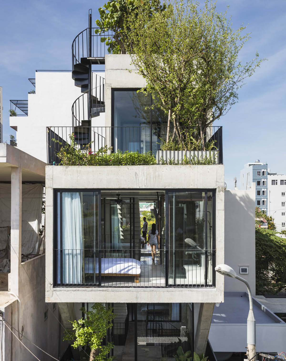 Ho Khue Architects' concrete house is inspired by imaginations of children’s LEGO game in Vietnam