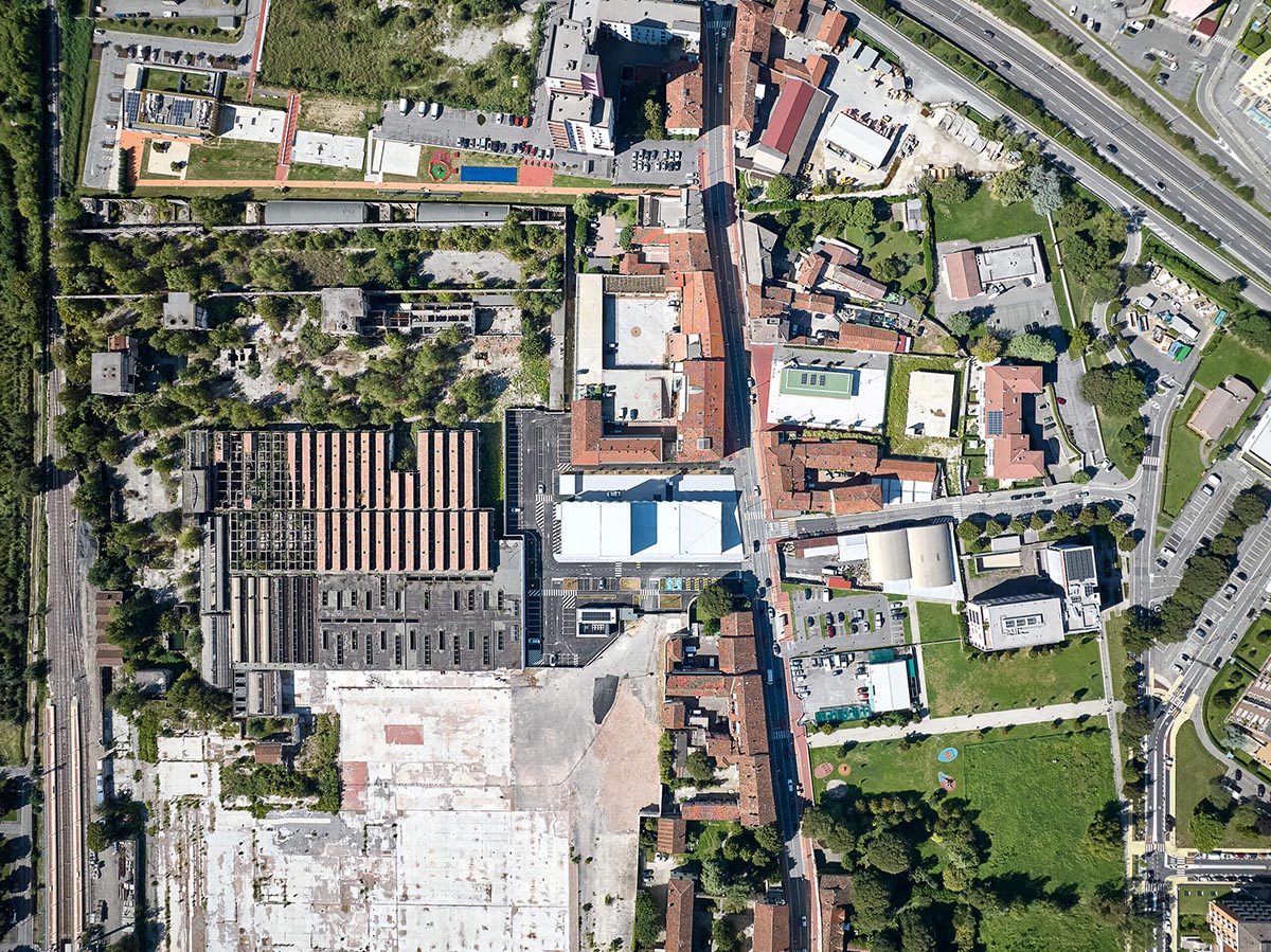 Teatro Borsoni theater is wrapped by façades that feature 3D-punctuated concrete blocks in Italy