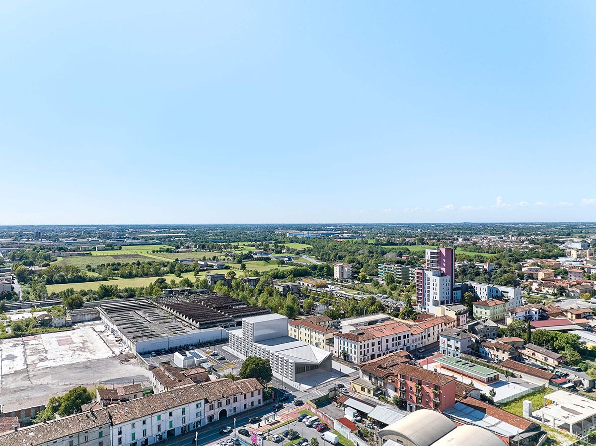 Teatro Borsoni theater is wrapped by façades that feature 3D-punctuated concrete blocks in Italy