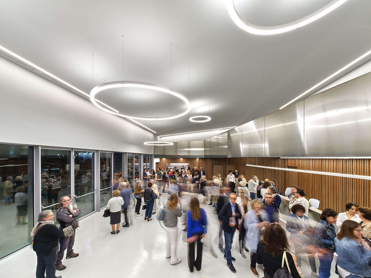 Teatro Borsoni theater is wrapped by façades that feature 3D-punctuated concrete blocks in Italy