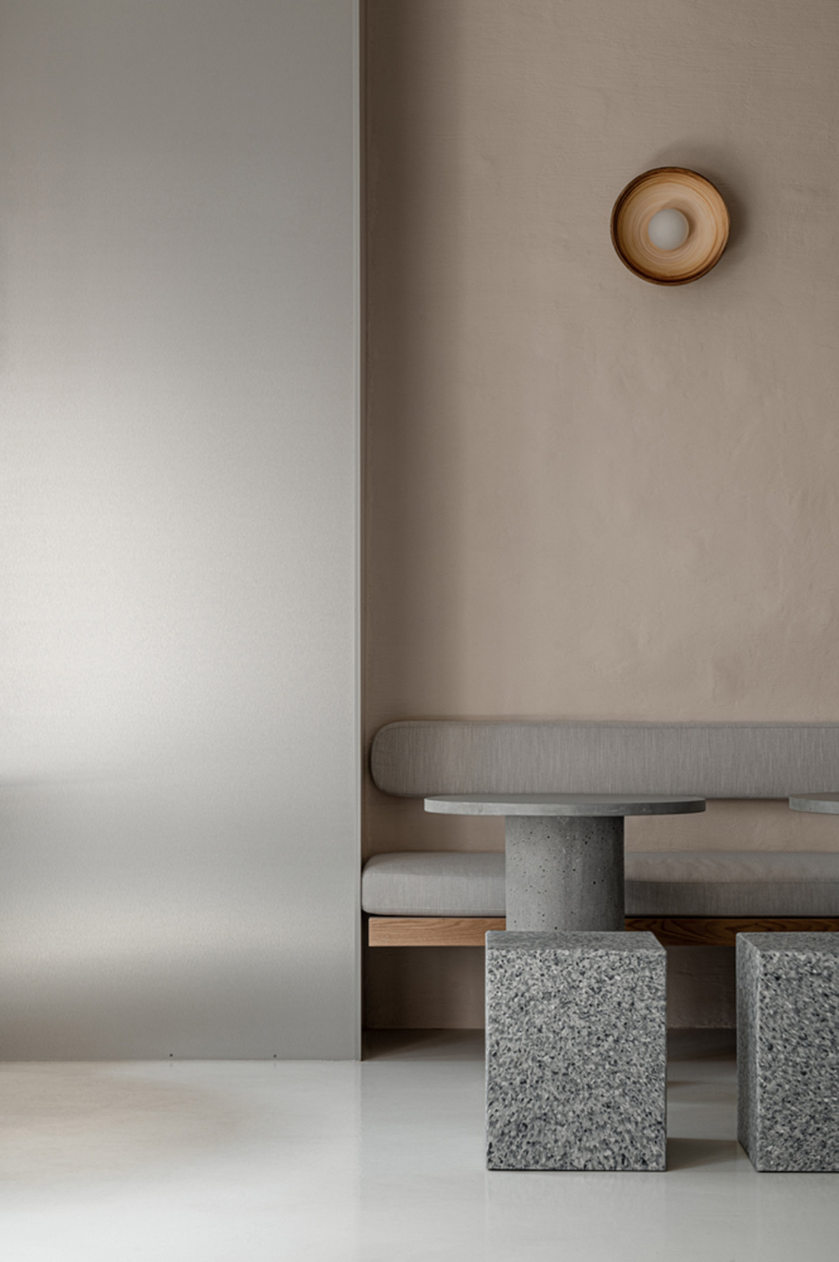 Earth-toned materials and soft lines form interiors of this ready-to-eat food restaurant in Kyiv