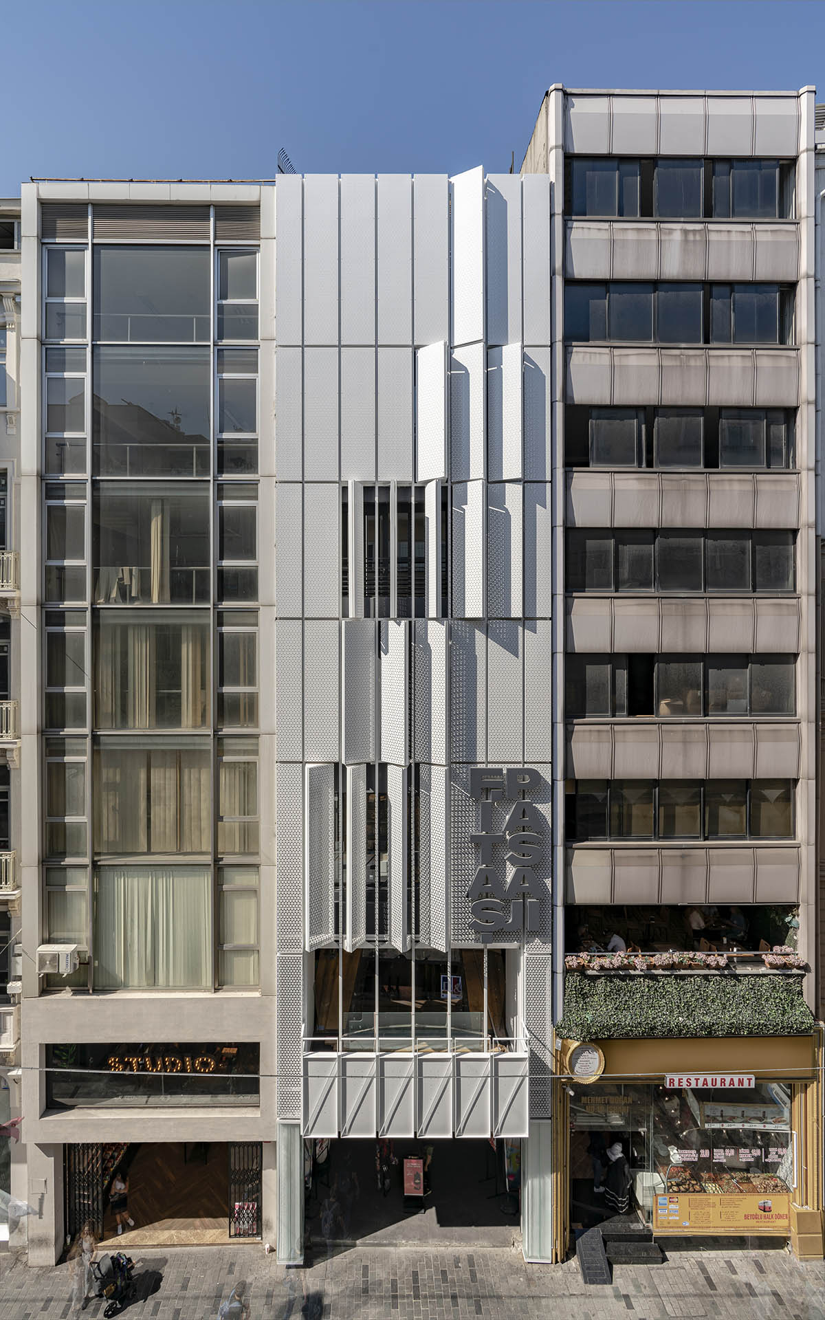 Salon Alper Derinbogaz renovates historic arcade passage with angular perforated panels in Istanbul
