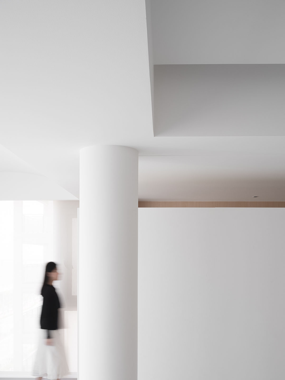 AD ARCHITECTURE creates all-white interiors with geometric compositions for L Apartment in China