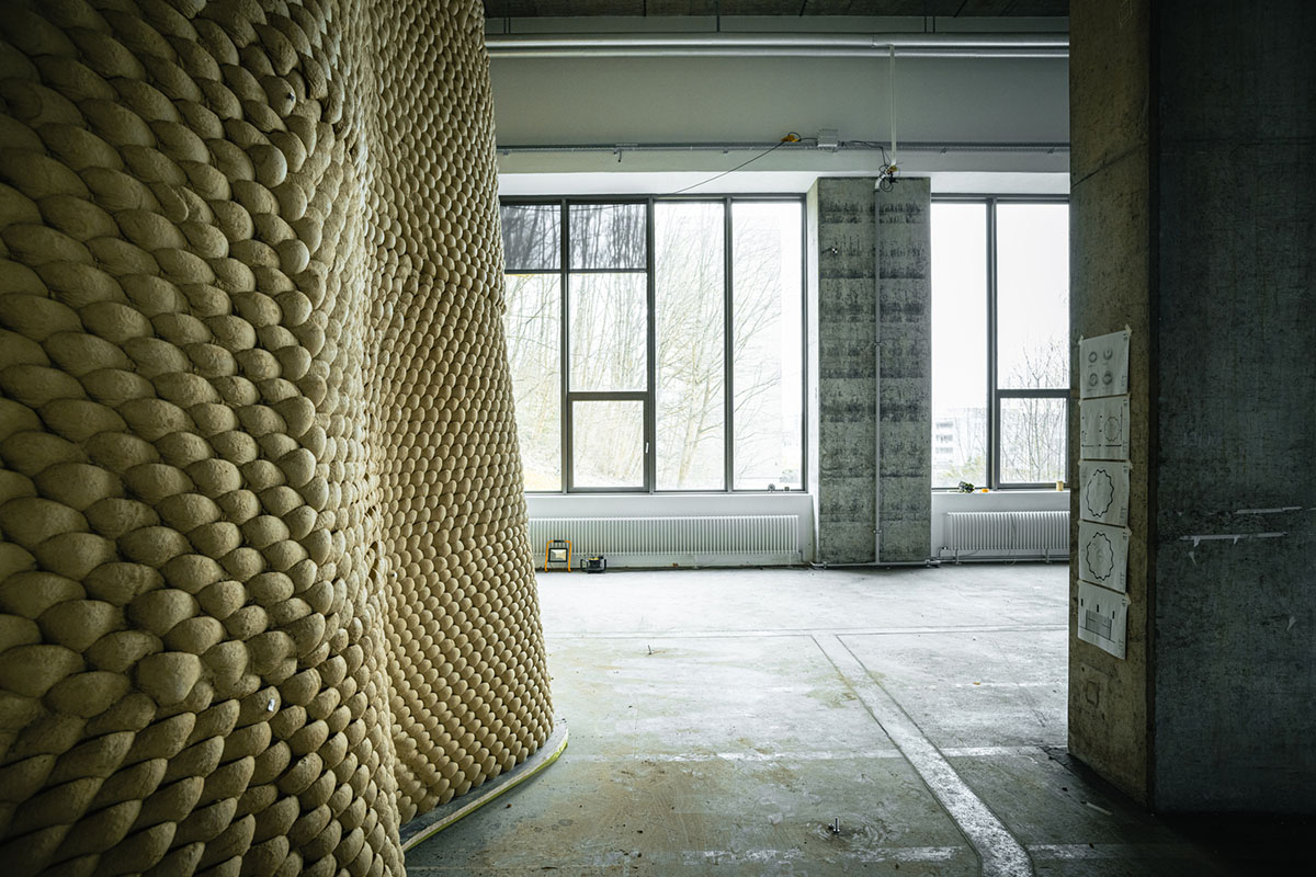 Gramazio Kohler Research used 30,000 soft clay bricks to install undulating clay rotunda in Bern