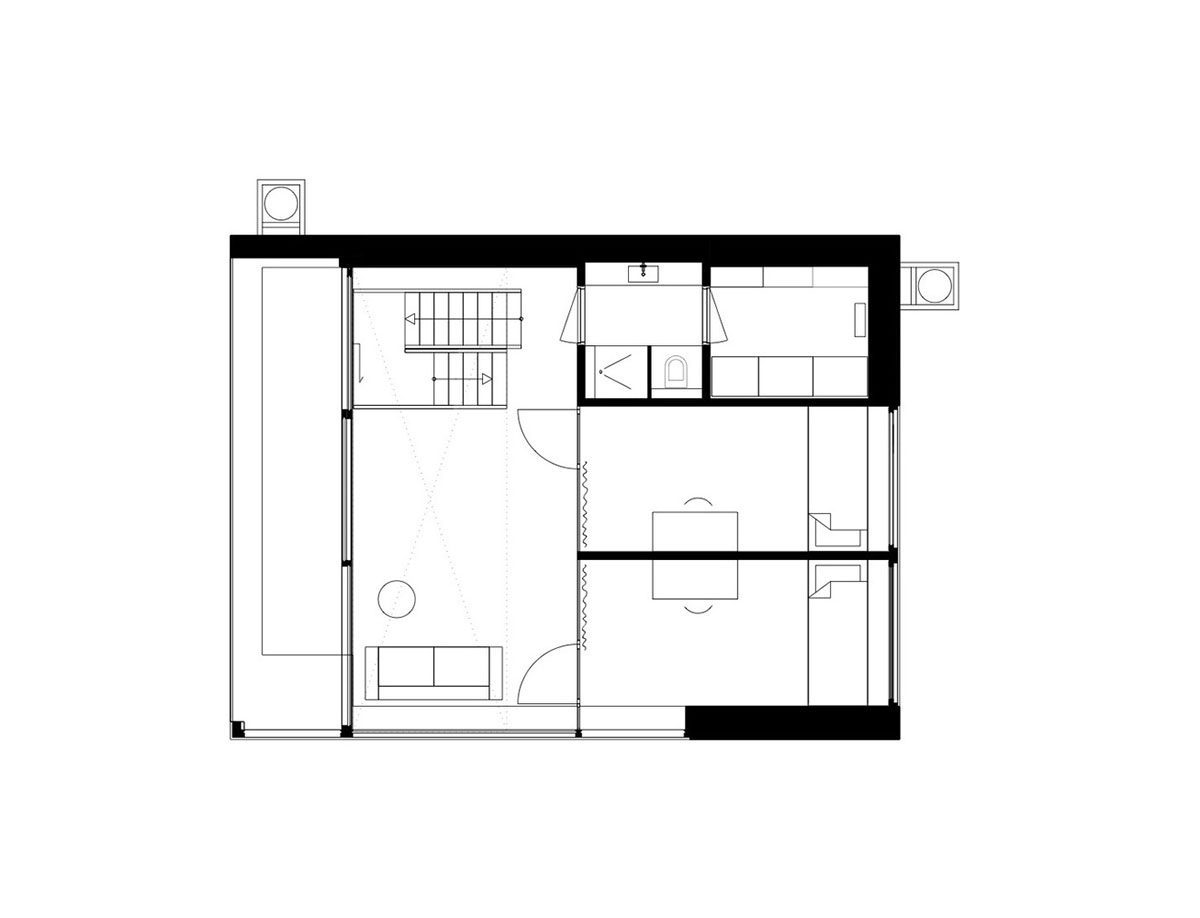 i29 built floating house with black timber and cut-out roof as part of floating village in Amsterdam