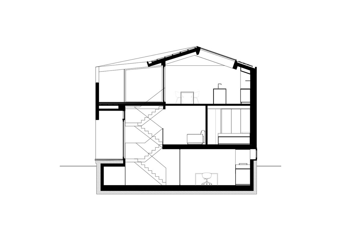 i29 built floating house with black timber and cut-out roof as part of floating village in Amsterdam