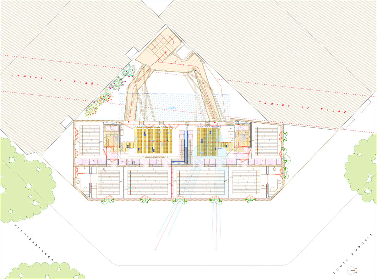 La Carboneria housing block features a dramatic courtyard with crossing beams in Barcelona