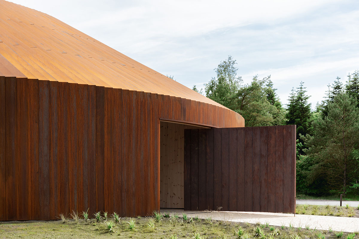 BIG completes new refugee museum in Denmark with soft curve corten steel volume