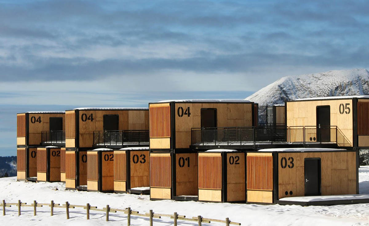 Real wooden shipping containers provide nomadic accommodation designed by Ora Ito