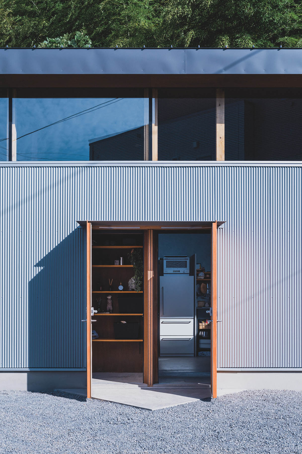 IGArchitects creates two-family house around a forest of wooden pillars in Japan 