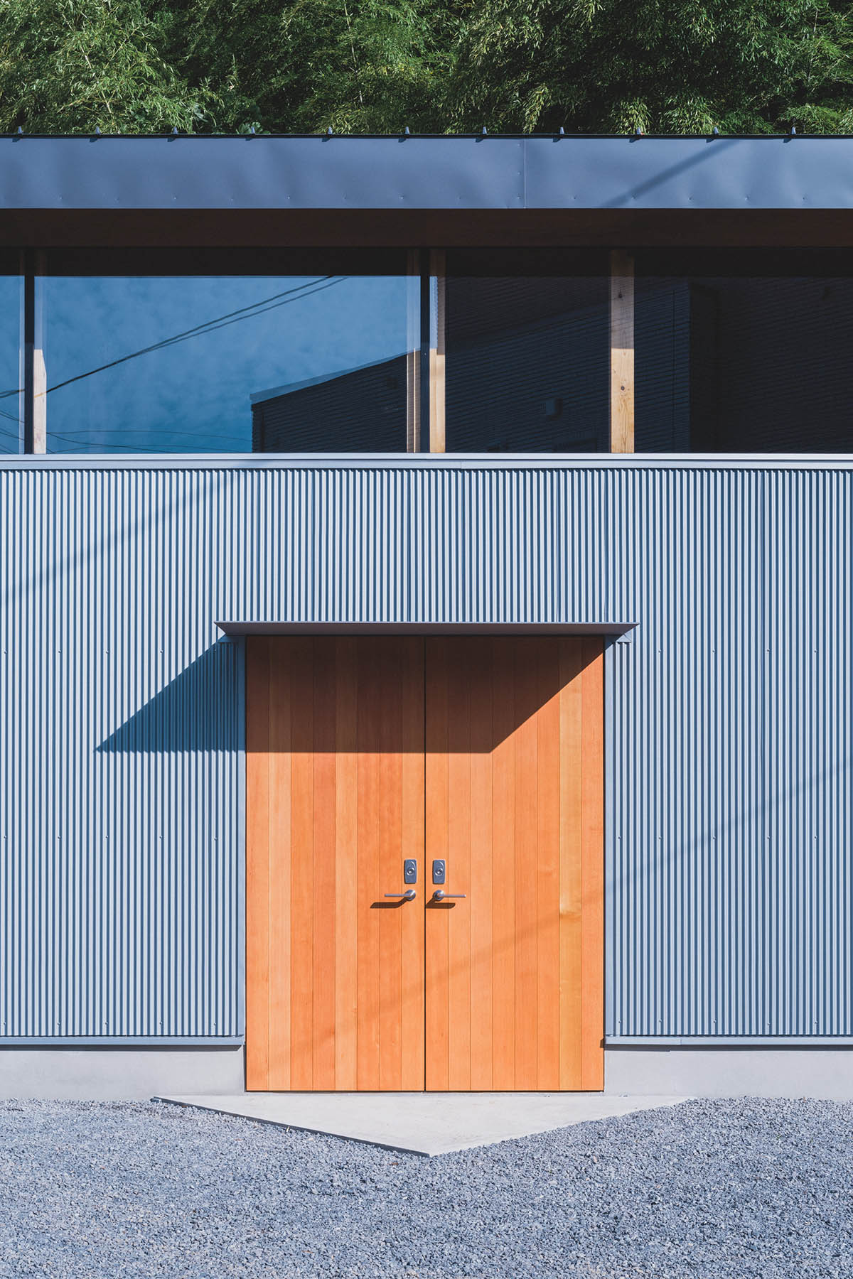IGArchitects creates two-family house around a forest of wooden pillars in Japan 