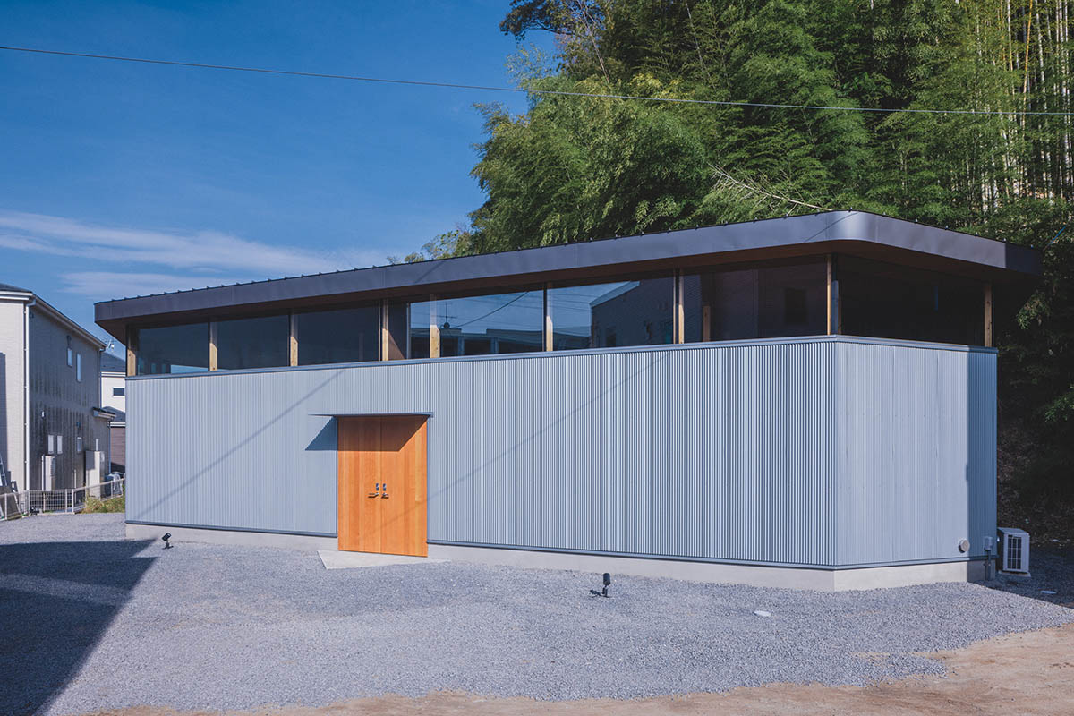 IGArchitects creates two-family house around a forest of wooden pillars in Japan 