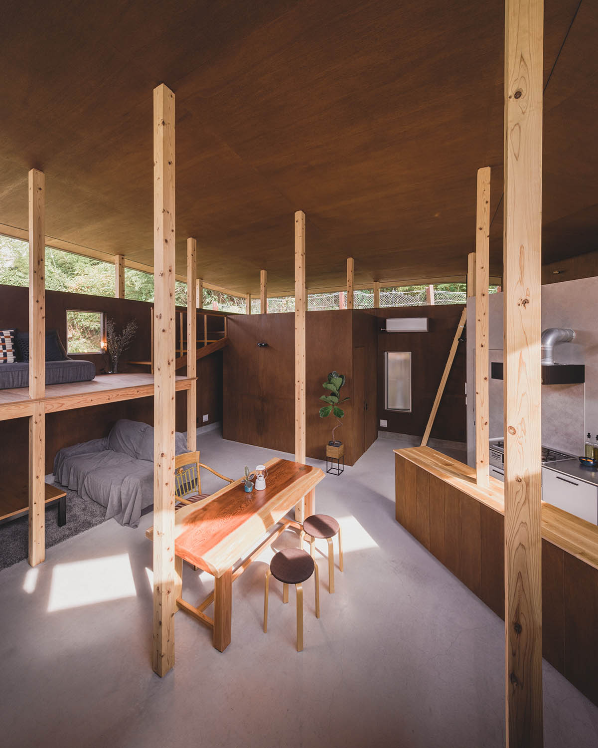 IGArchitects creates two-family house around a forest of wooden pillars in Japan 