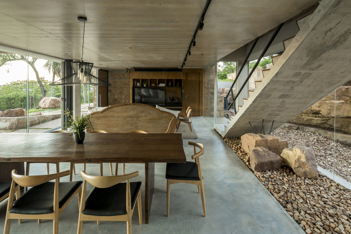 OMCM arquitectos brings rocky landscape inside of this weekend house in Paraguay