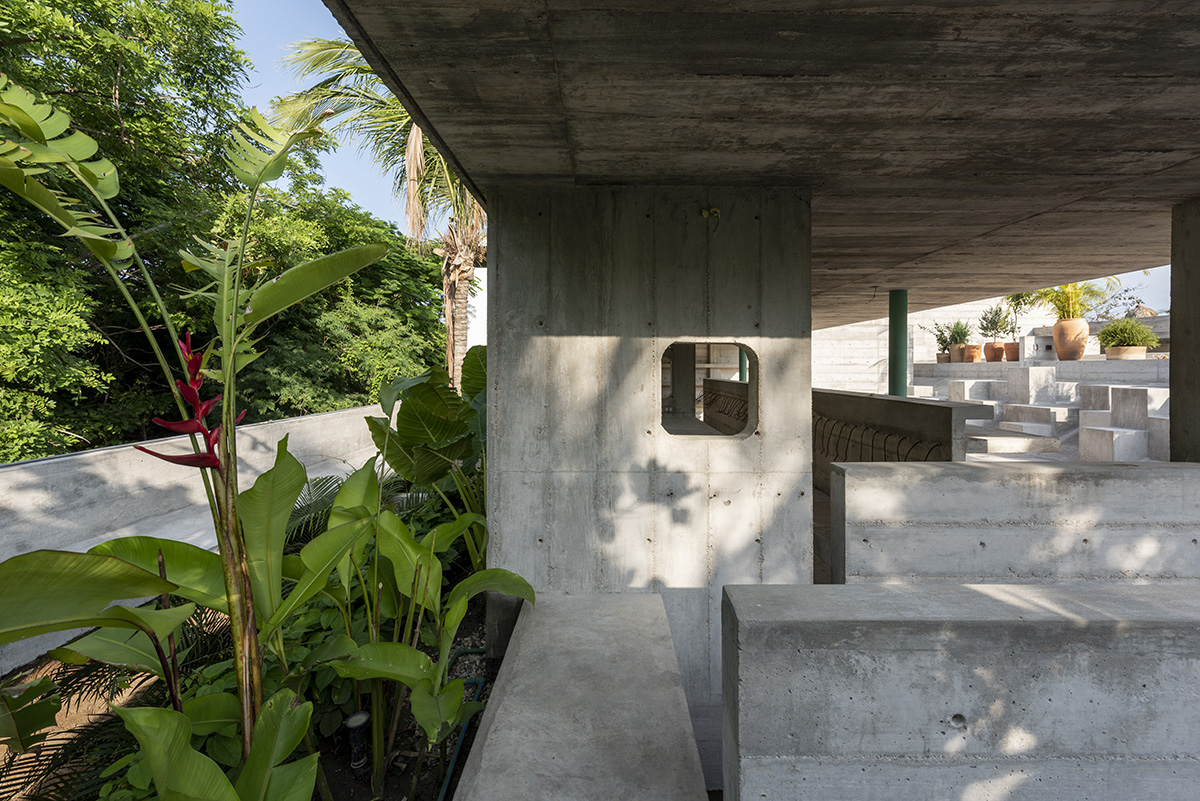 Casa TO by Ludwig Godefroy features an island of stairs and vaulted volumes to create discreet oasis