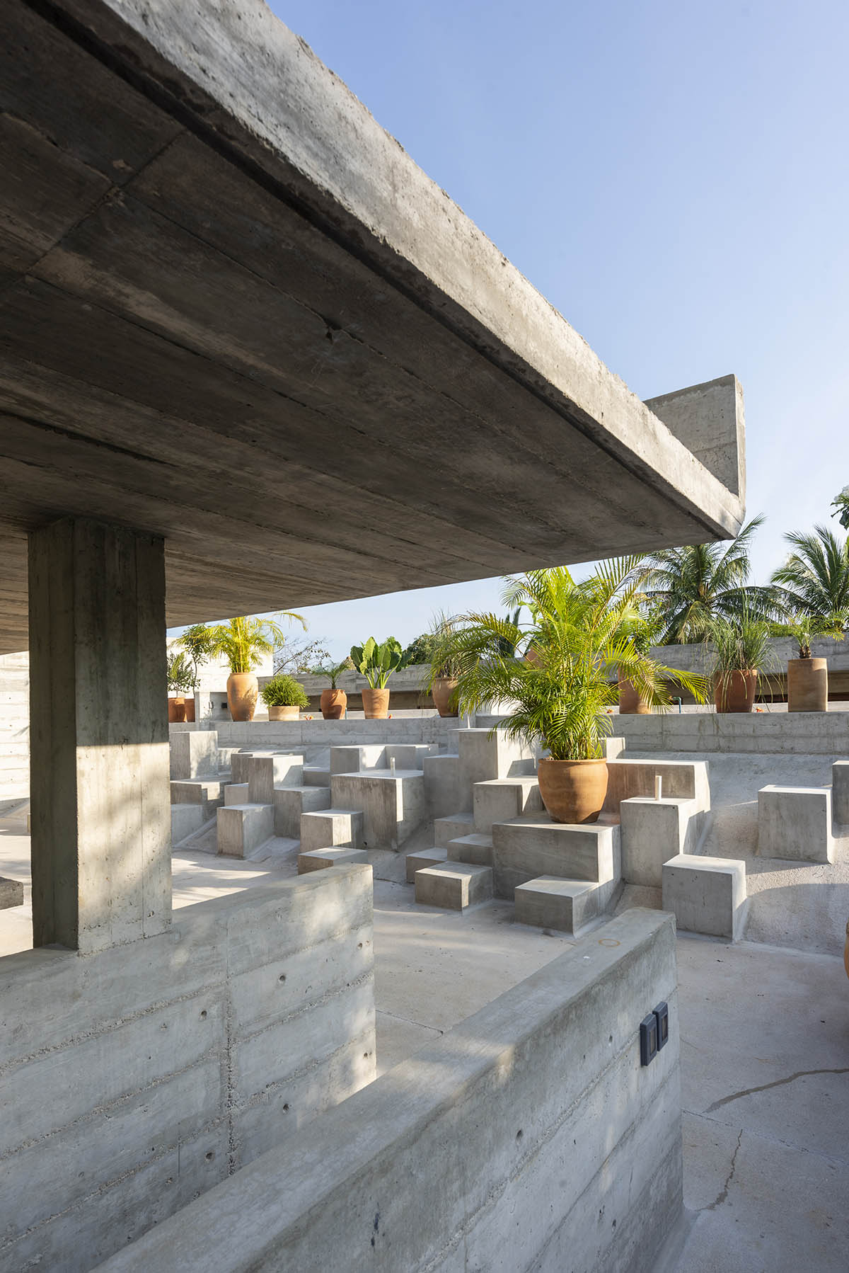 Casa TO by Ludwig Godefroy features an island of stairs and vaulted volumes to create discreet oasis