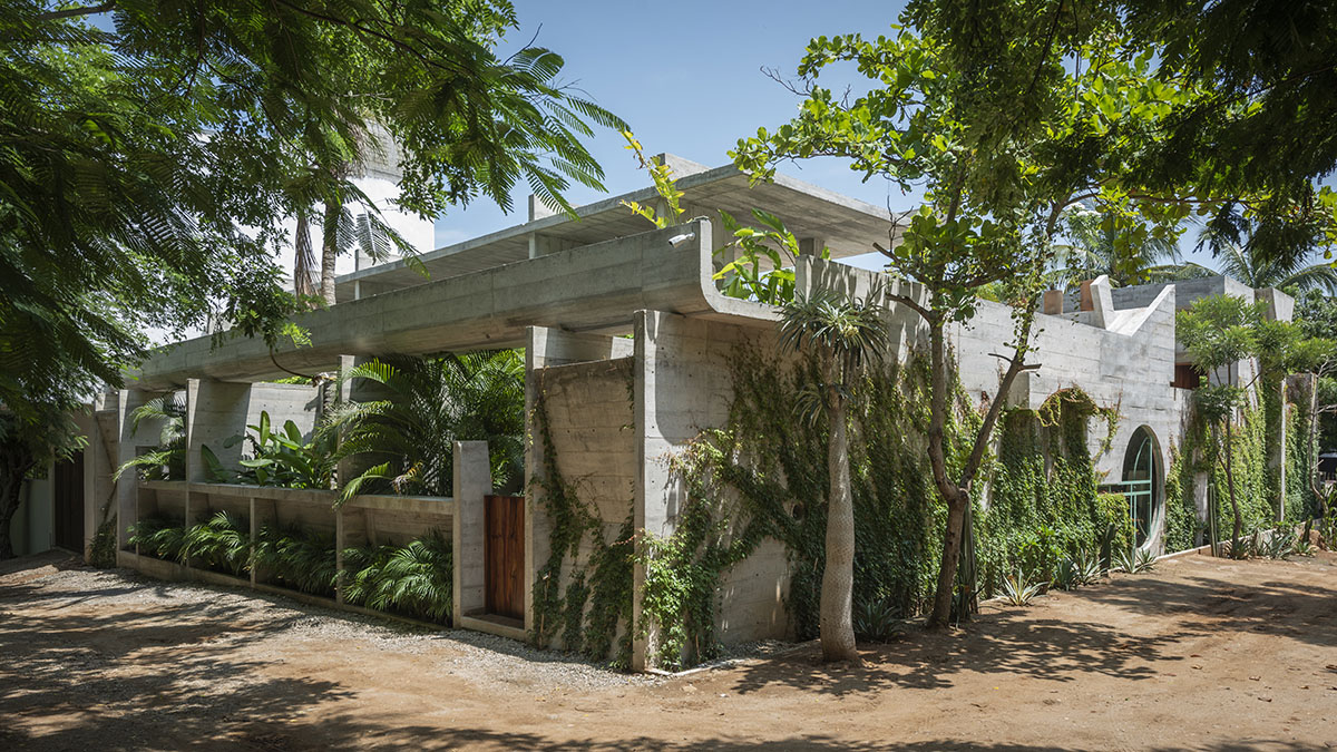Casa TO by Ludwig Godefroy features an island of stairs and vaulted volumes to create discreet oasis