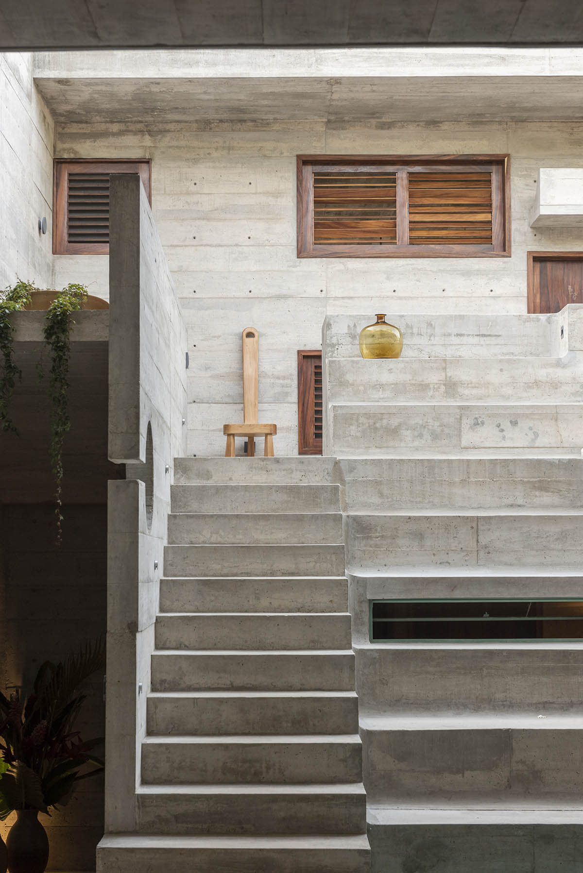 Casa TO by Ludwig Godefroy features an island of stairs and vaulted volumes to create discreet oasis