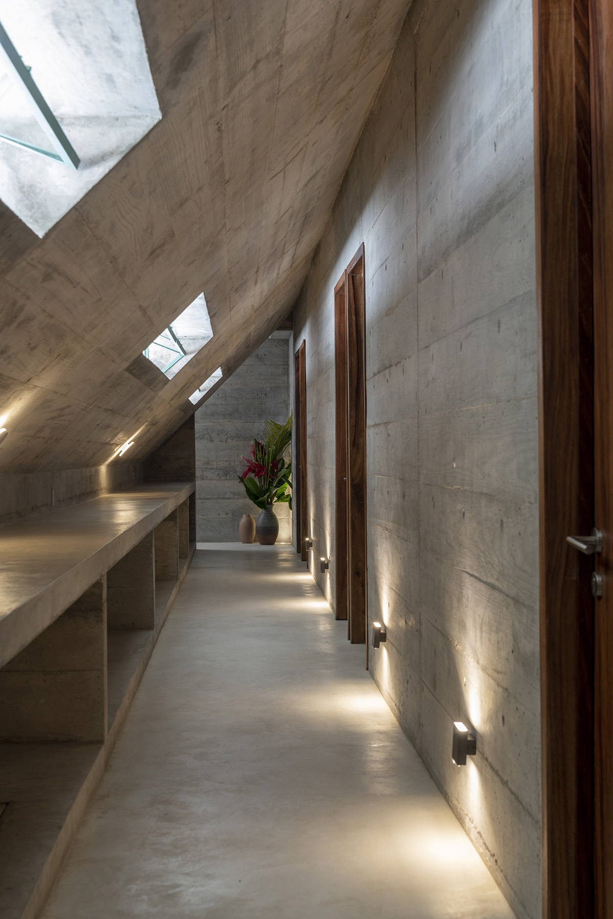 Casa TO by Ludwig Godefroy features an island of stairs and vaulted volumes to create discreet oasis