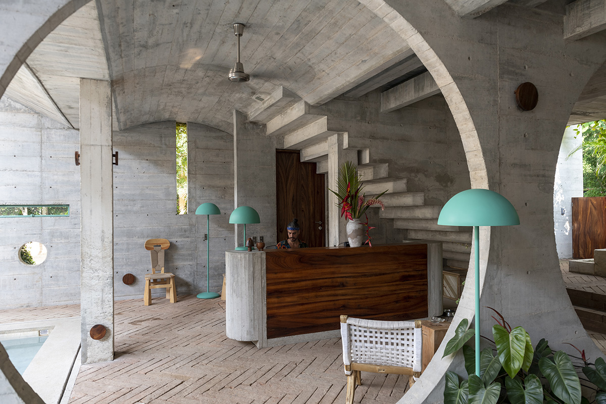 Casa TO by Ludwig Godefroy features an island of stairs and vaulted volumes to create discreet oasis