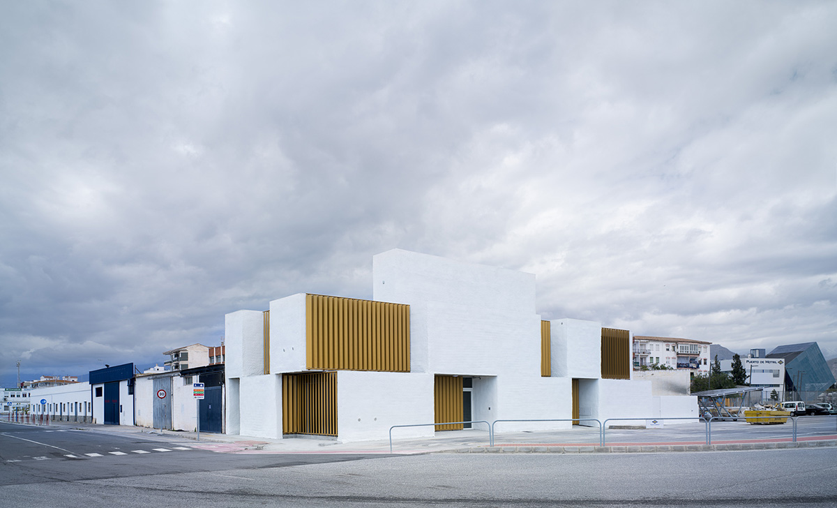 White cubic volumes combined with inward system of patios to create zero-energy Port Operations HQ