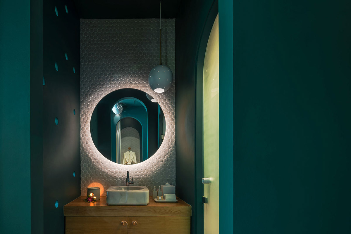 onion combines white concave and convex walls with colorful surfaces for beach resort in Thailand